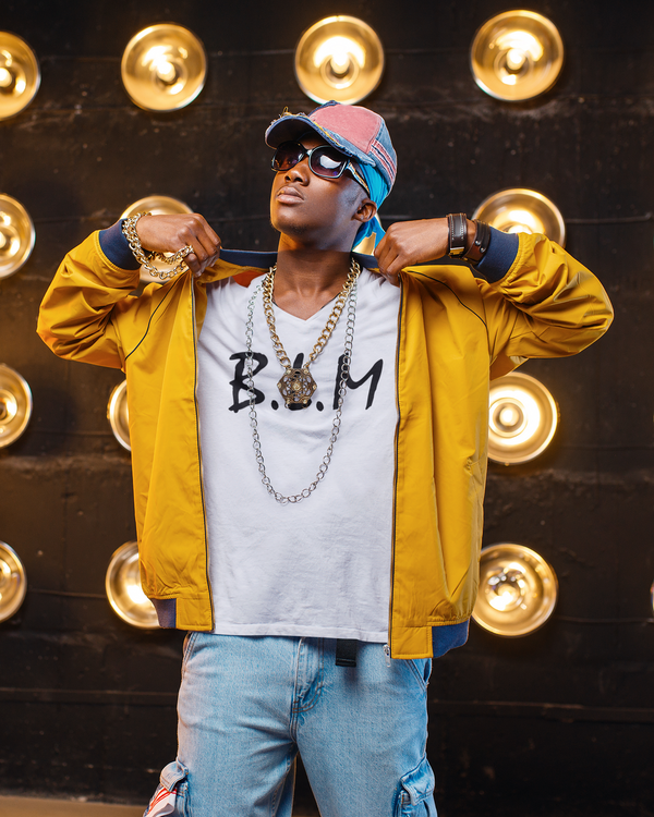 t shirt mockup of a rapper wearing gold chains on a set