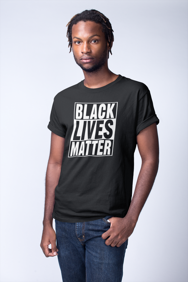 young black man wearing a short sleeved t-shirt in a white room
